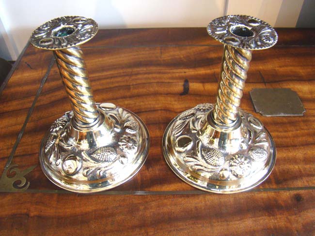 A fine pair of English brass repousse candlesticks circa 1870